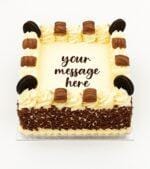 Kinder and Oreo fresh cream birthday cake with chocolate flakes, Kinder chocolate bars, Oreo biscuits, and personalised message
