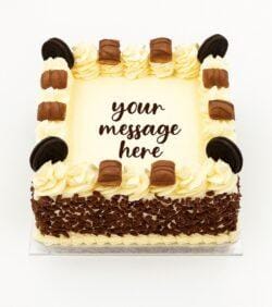 Kinder and Oreo fresh cream birthday cake with chocolate flakes, Kinder chocolate bars, Oreo biscuits, and personalised message