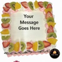 Egg-free fresh fruit fresh cream cake topped with strawberries, kiwi, pineapple, and personalised message