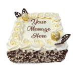 Egg Free Ferrero Chocolate Celebration Cake decorated with Ferrero chocolates, chocolate leaves, mixed chocolate curls and a personalised message.