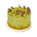 Premium pistachio celebration cake with chocolate decorations in Sheffield
