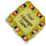 Egg free pistachio cake topped with fresh fruit from Cake Palace Sheffield