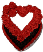 Egg Free red heart-shaped celebration cake with red rose decorations and chocolate flakes around the sides