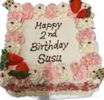 Egg Free square celebration cake decorated with pink and white cream swirls, fresh strawberries and a personalised birthday message