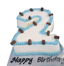 Egg Free number 2 birthday cake with blue piping, chocolate flakes and personalised message, available in any number 0–9 from Cake Palace Sheffield