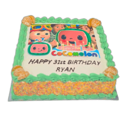 Egg Free Cocomelon Photo Birthday Cake with an edible Cocomelon image, green cream borders, rainbow sprinkle sides and a personalised message.
