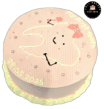Cute tooth fairy birthday cake with smiling tooth design on pastel pink frosting