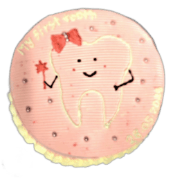 Round pink tooth-themed birthday cake with adorable tooth character and personalized message
