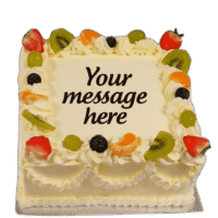 Egg Free Fresh Fruit Celebration Cake decorated with strawberries, kiwi, grapes, mandarin segments, blueberries and a personalised message.