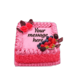 Egg Free Pink Berry Celebration Cake decorated with fresh strawberries, blueberries, raspberries, blackberries and chocolate decorations