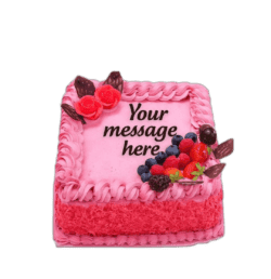Egg Free Pink Berry Celebration Cake decorated with fresh strawberries, blueberries, raspberries, blackberries and chocolate decorations