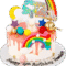 Personalised Rainbow Unicorn Birthday Cake decorated with rainbow, unicorn figurine, colourful drip finish, clouds, stars and birthday message.