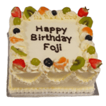 Square Egg Free fresh fruit cake with a smooth cream finish, colourful fruit topping and custom message area.