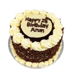 Egg Free Black Forest Celebration Cake decorated with chocolate curls, cream swirls and a personalised chocolate message plaque.