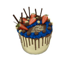 Egg Free tall chocolate drip cake decorated with fresh strawberries, chocolate sticks, chocolate pieces, chocolate pearls and a personalised message.