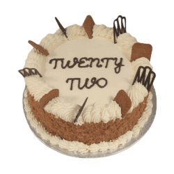 Egg Free Biscoff Celebration Cake decorated with Lotus Biscoff biscuits, Biscoff crumb coating, decorative chocolate pieces and a personalised message.