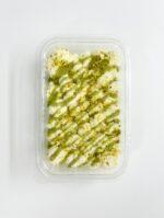 Pistachio Rose: pistachio drizzle with dried rose petals. Green Swirl: alternating white and pistachio cream lines. Premium Nut Mix: pistachio, almond slivers, white chocolate curls. Minimal Elegant: smooth cream, center pistachio mound, thin green drizzle. Pistachio Crunch: caramelized pistachio crumble on top. Layered Pattern: diagonal pistachio sauce with chopped nuts between each line.