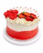 Luxury Tall Strawberry & Rose Fresh Cream Cake decorated with smooth white and red ombre fresh cream, handcrafted fresh cream roses, fresh strawberries, delicate white flowers, and gold sugar pearls. Freshly made in Sheffield.