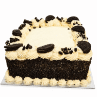 Square Oreo chocolate celebration cake decorated with smooth whipped frosting, Oreo biscuit halves, crunchy Oreo cookie crumb pieces, and chocolate sprinkles covering the sides, with a smooth centre for a personalised birthday or celebration message.