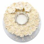 Elegant Ivory Crown Wedding Cake with ivory fresh cream rosettes, silver crown topper, egg-free fresh cream vanilla or chocolate sponge from Cake Palace.