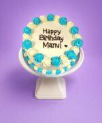Egg Free Blue & White Round Celebration Cake with blue and white cream swirls and a personalised birthday message.
