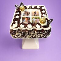 Round personalised photo celebration cake with smooth fresh cream icing, edible photo print, chocolate rosettes, Ferrero Rocher chocolates, chocolate curls and personalised message, handmade by Cake Palace UK.