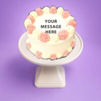 Egg Free Pink & White Celebration Cake with elegant pink and white cream swirls and a personalised message