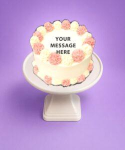Egg Free Pink & White Celebration Cake with elegant pink and white cream swirls and a personalised message