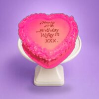 Egg Free Pink Heart Celebration Cake with a vibrant pink cream finish, decorative cream border, edible pearls and a personalised message.