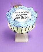 stylish Egg Free Blue Chocolate Drip Birthday Cake decorated with blue piping, chocolate drip, edible pearls and a personalised cake topper. Freshly made to order in Sheffield for birthdays and special celebrations.