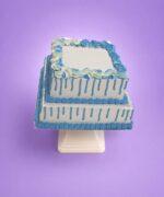 Egg Free Blue Drip Tier Celebration Cake with two square tiers, blue drip decoration and elegant blue cream swirls.
