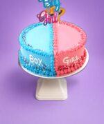 Boy or Girl gender reveal heart cake with blue and pink frosting and topper