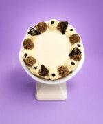 Top view of Classic Chocolate & Vanilla Celebration Cake featuring chocolate and vanilla buttercream swirls, elegant chocolate piping, handcrafted chocolate decorations, and a smooth centre ready for a personalised birthday or celebration message. Freshly made in Sheffield.
