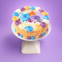 Top view of Colourful Kids Photo Birthday Cake featuring an edible cartoon character image, pastel fresh cream swirls, and personalised birthday design.