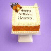 Egg-free Lotus Biscoff birthday cake with Biscoff biscuits, Ferrero Rocher chocolates, chocolate decorations, vanilla buttercream border and personalised birthday message.
