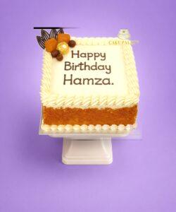 Egg-free Lotus Biscoff birthday cake with Biscoff biscuits, Ferrero Rocher chocolates, chocolate decorations, vanilla buttercream border and personalised birthday message.