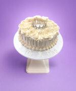 Elegant Ivory Crown Wedding Cake with ivory fresh cream rosettes, silver crown topper, egg-free vanilla or chocolate sponge from Cake Palace.