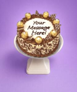 Treat your guests to our handcrafted Egg Free Ferrero Celebration Cake, beautifully decorated with Ferrero chocolates, chocolate wafer pieces, chocolate swirls and chocolate flakes around the sides. Perfect for birthdays and special occasions, this elegant cake can be personalised with your own message. Freshly made to order in Sheffield and available in Chocolate, Mix Fruit Jam, Biscoff, Mango or Pistachio flavours.