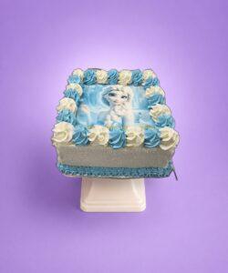Egg Free Frozen Elsa photo birthday cake with blue and white decorative piping made in Sheffield