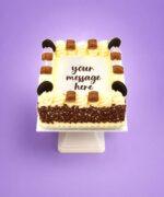Kinder and Oreo fresh cream birthday cake with chocolate flakes, Kinder chocolate bars, Oreo biscuits, and personalised message