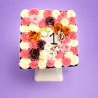 Top view of Classic Chocolate & Vanilla Celebration Cake featuring chocolate and vanilla buttercream swirls, elegant chocolate piping, handcrafted chocolate decorations, and a smooth centre ready for a personalised birthday or celebration message. Freshly made in Sheffield.