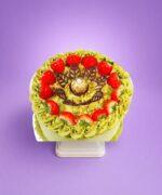 Luxury egg-free pistachio fresh cream cake with fresh strawberries, crushed pistachios, Ferrero Rocher chocolate, and chocolate leaf decorations