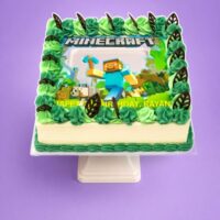 Minecraft photo birthday cake with edible image, green fresh cream rosettes and chocolate leaf decorations
