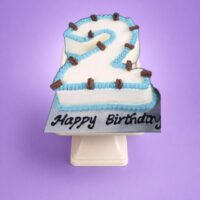 Egg Free number 2 birthday cake with blue piping, chocolate flakes and personalised message, available in any number 0–9 from Cake Palace Sheffield