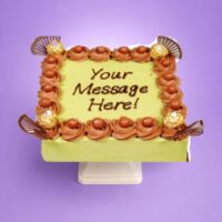 Egg-free pistachio fresh cream cake decorated with Ferrero Rocher chocolates, chocolate curls, chocolate pearls, and personalised message