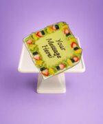 Egg free pistachio cake topped with fresh fruit from Cake Palace Sheffield