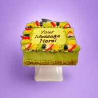 pistachio square celebration cake with strawberries and chocolates in Sheffield