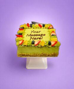 pistachio square celebration cake with strawberries and chocolates in Sheffield