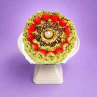 Round strawberry,fans and Ferrero pistachio cream cake